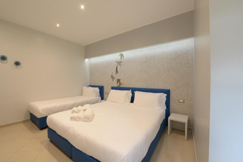 Postel nebo postele na pokoji v ubytování Imperiali Hotel