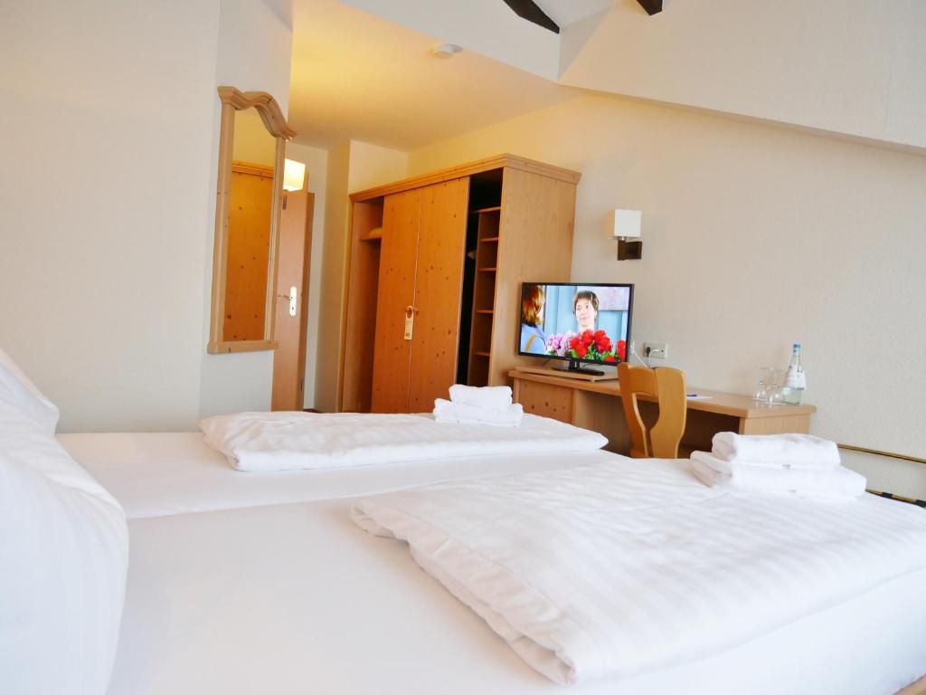 Postel nebo postele na pokoji v ubytování R&R Hotel Strandallee