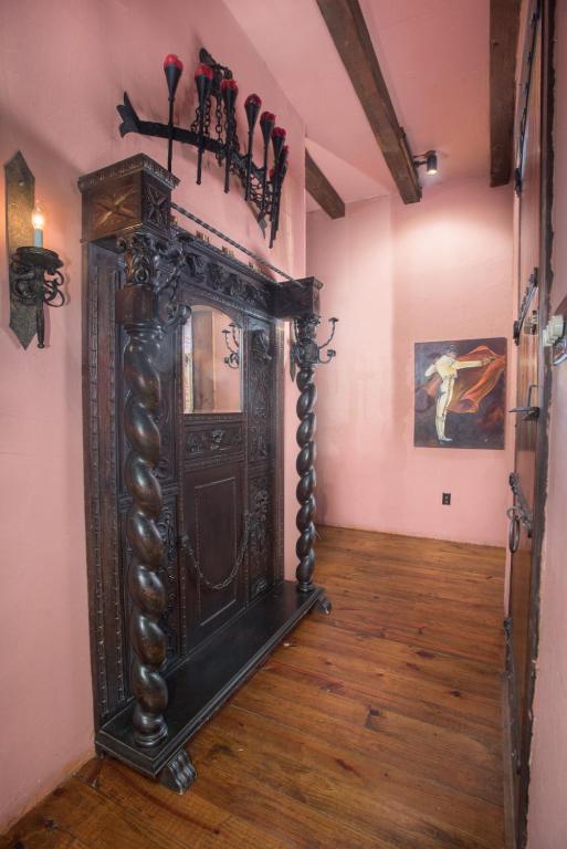 an old wooden grandfather clock in a room at 7F Lodge and Events in College Station