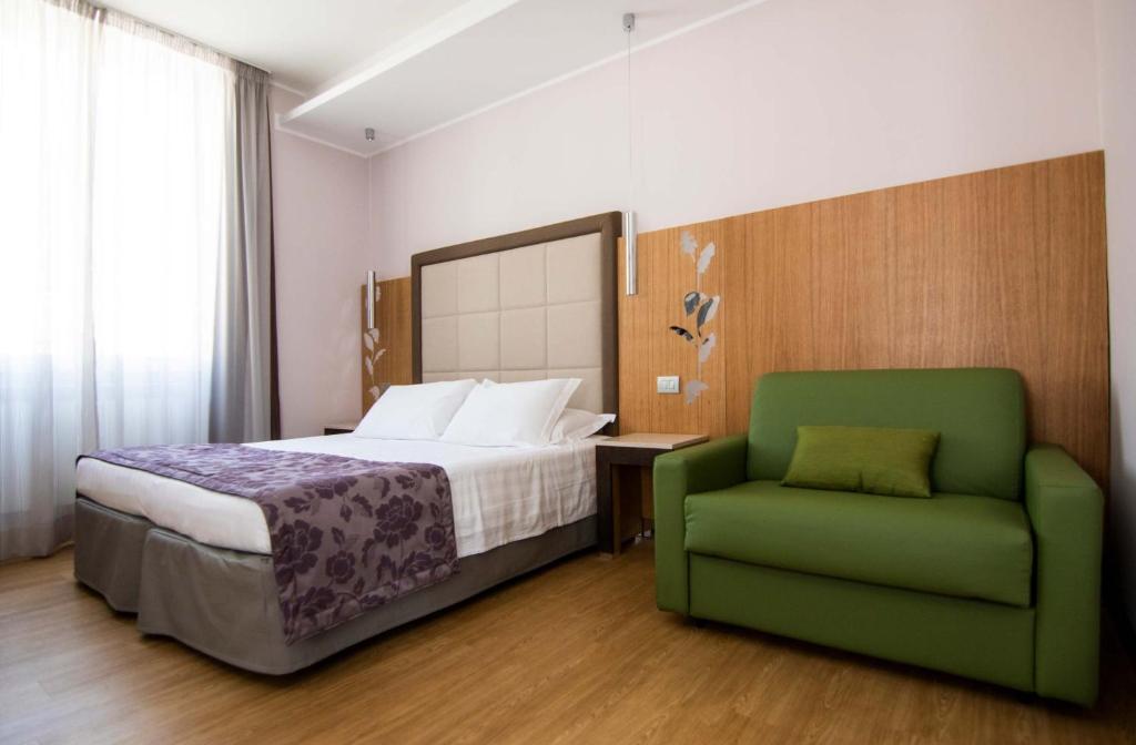 Postel nebo postele na pokoji v ubytování Hotel Giolli Nazionale