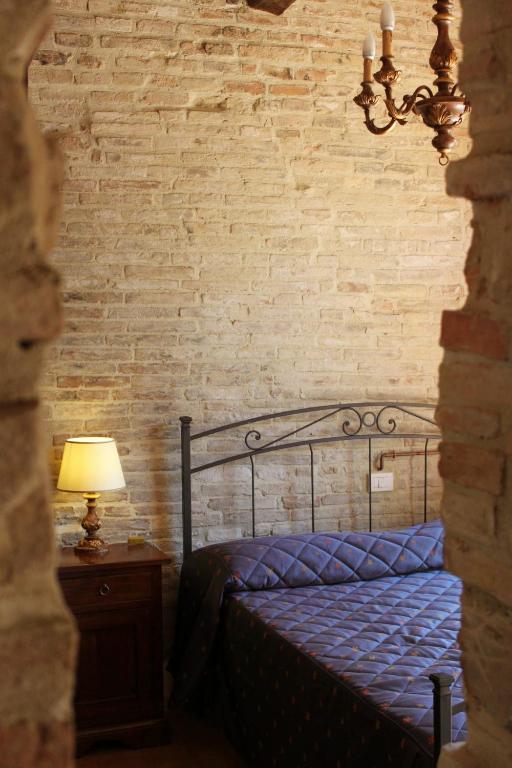 Postel nebo postele na pokoji v ubytování Villa Rinalducci