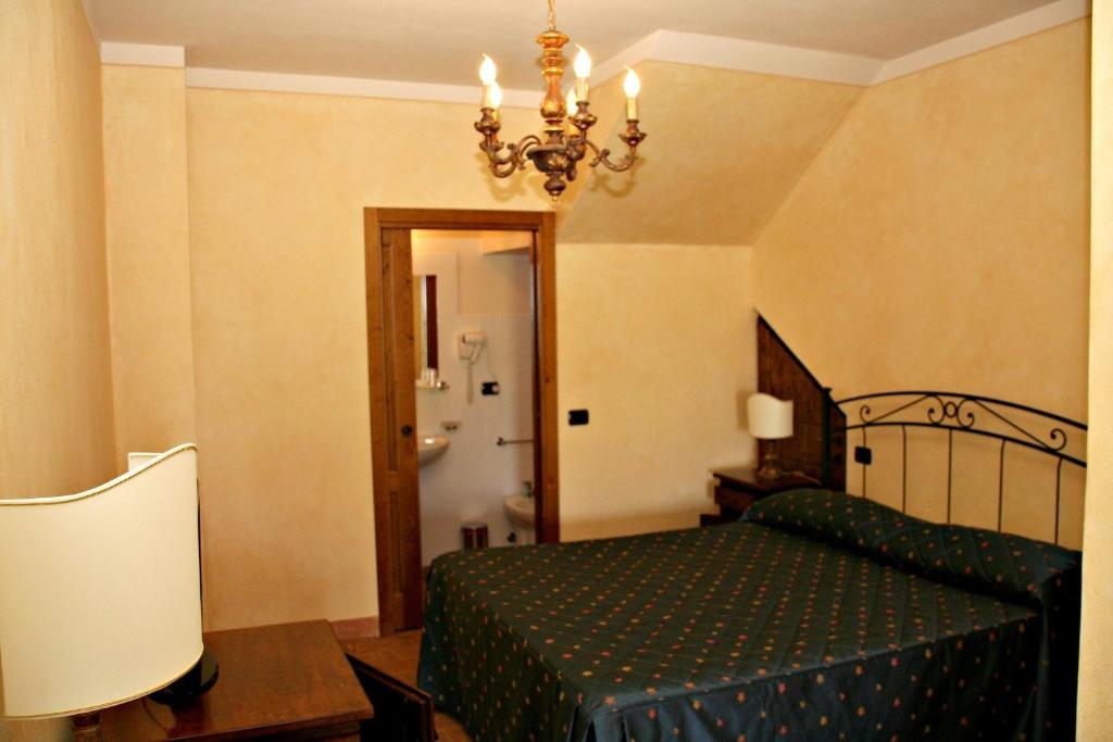 Postel nebo postele na pokoji v ubytování Villa Rinalducci