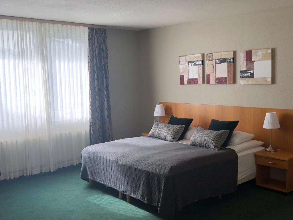 Postel nebo postele na pokoji v ubytování Hotel Hvolsvollur - Central South Iceland