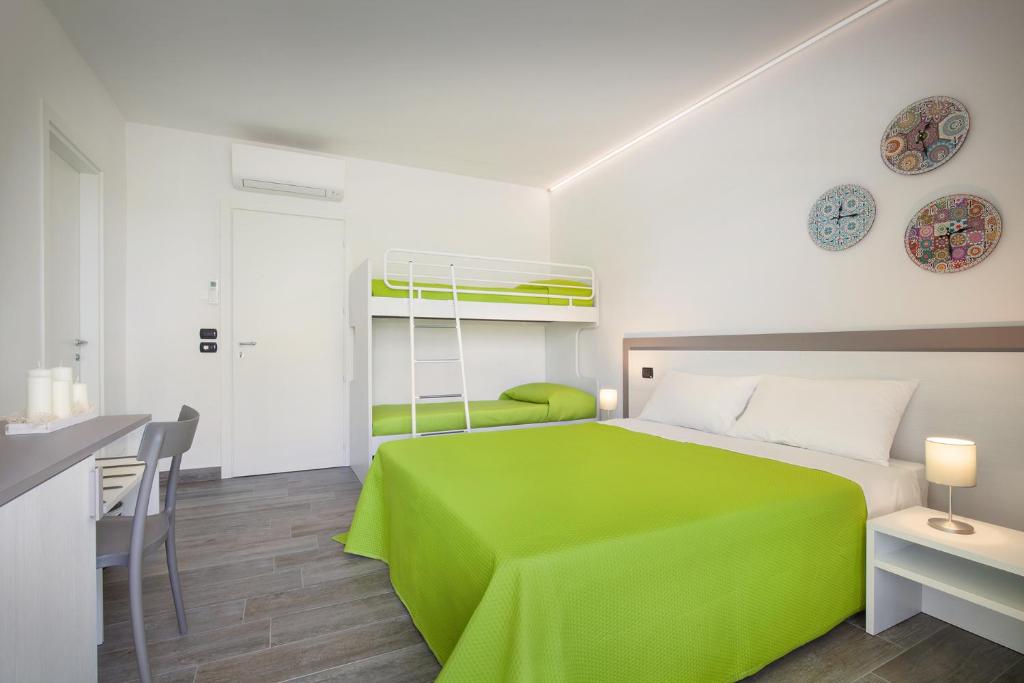 Postel nebo postele na pokoji v ubytování B&B I Tre Olivi