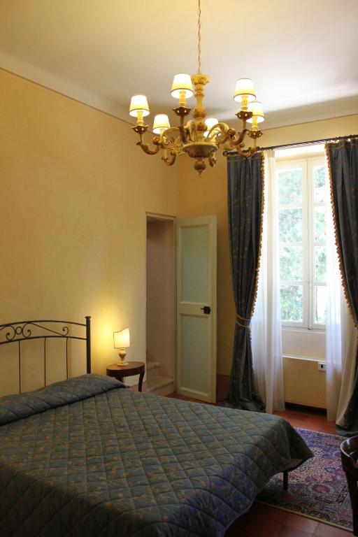 Postel nebo postele na pokoji v ubytování Villa Rinalducci