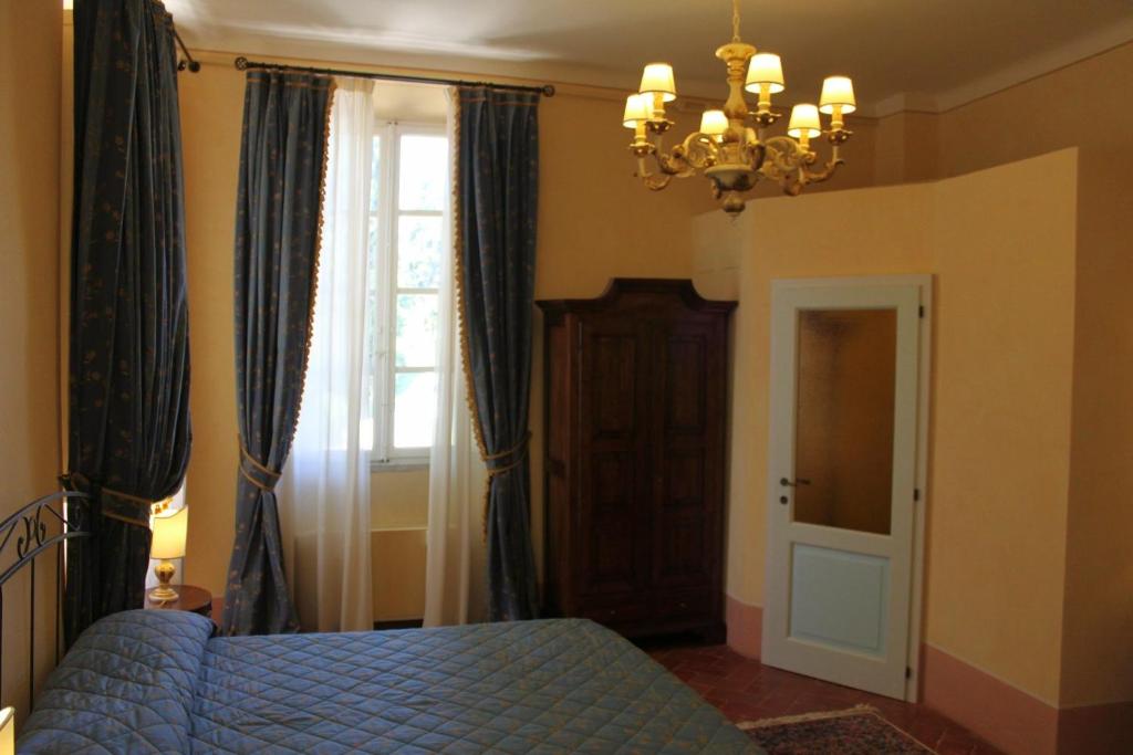 Postel nebo postele na pokoji v ubytování Villa Rinalducci