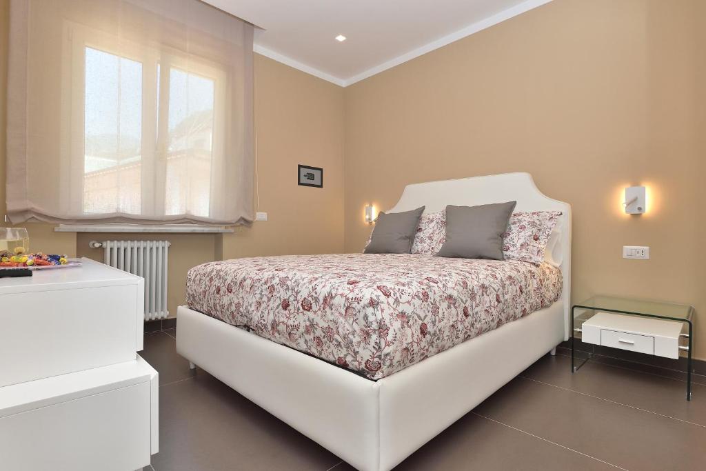 Łóżko lub łóżka w pokoju w obiekcie Costa d'Amalfi Apartments
