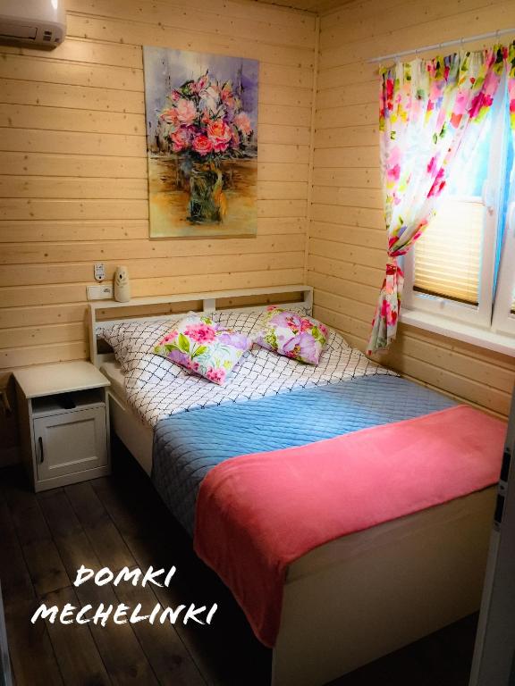 Postel nebo postele na pokoji v ubytování Domki Mechelinki