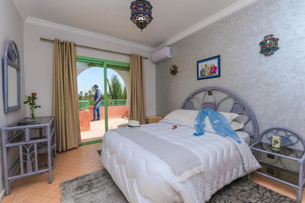 Postel nebo postele na pokoji v ubytování In Club Palmeraie Resorts