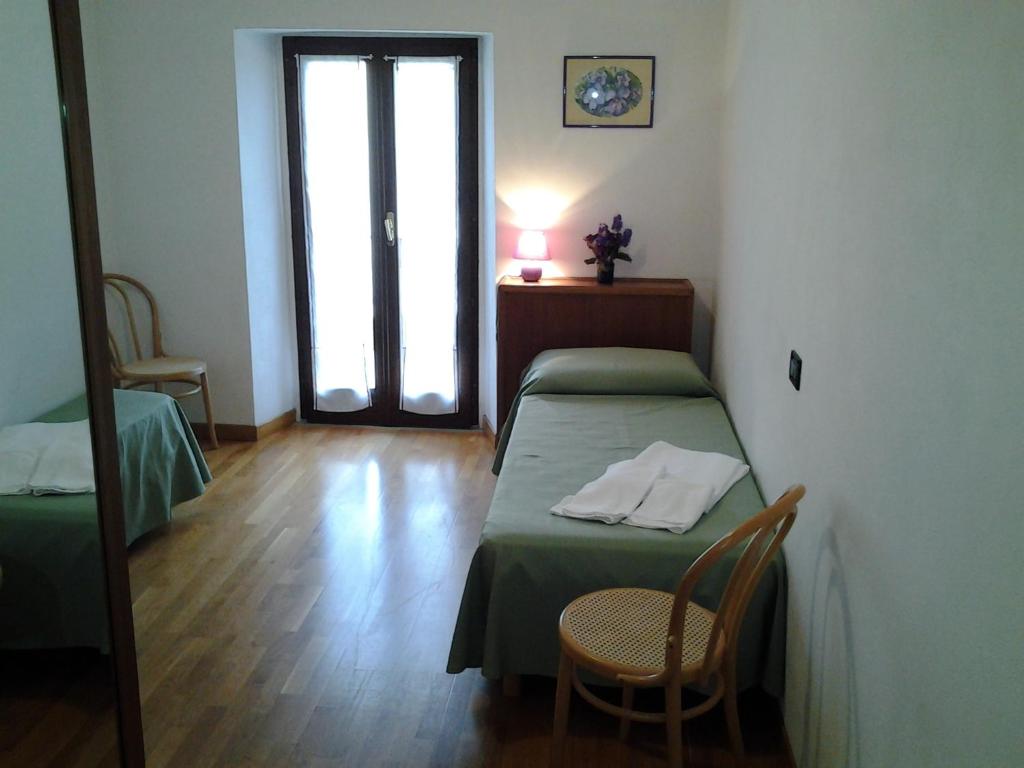 Postel nebo postele na pokoji v ubytování Cascina Roland