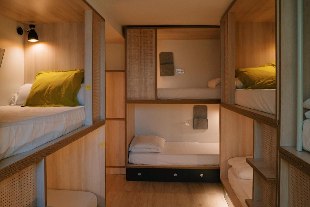Postel nebo postele na pokoji v ubytování Blai Blai Hostel
