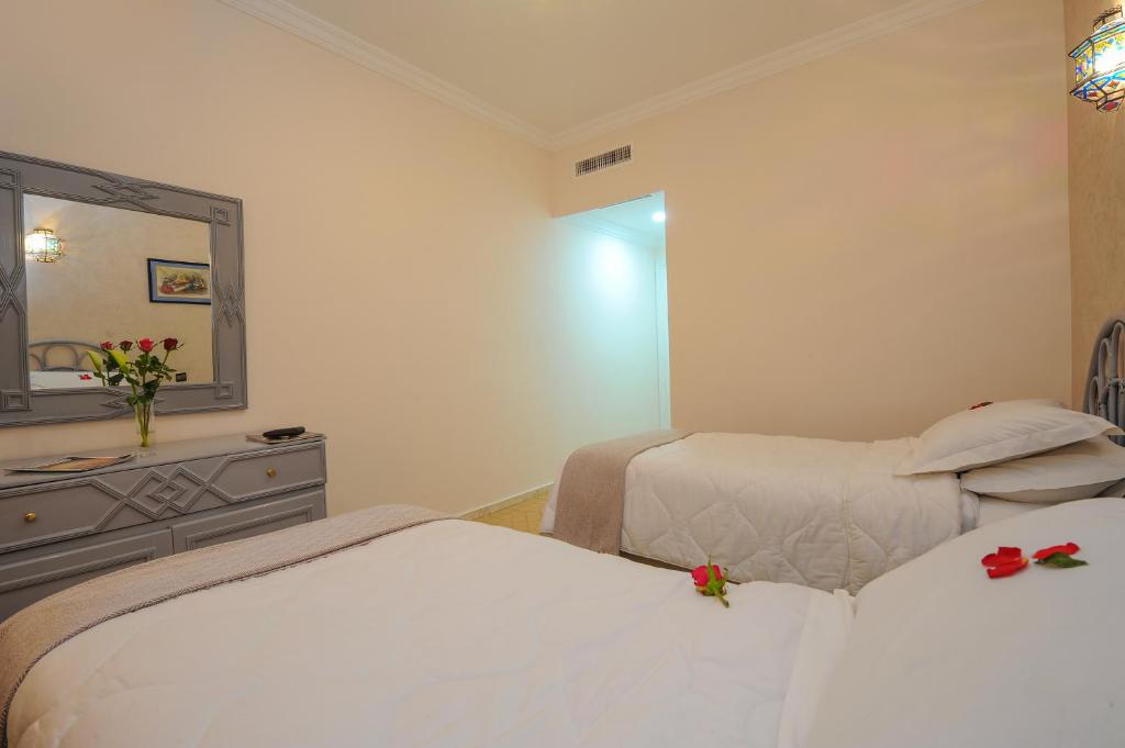 Postel nebo postele na pokoji v ubytování In Club Palmeraie Resorts
