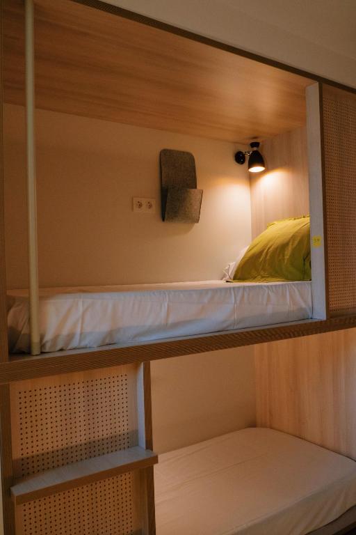 Postel nebo postele na pokoji v ubytování Blai Blai Hostel