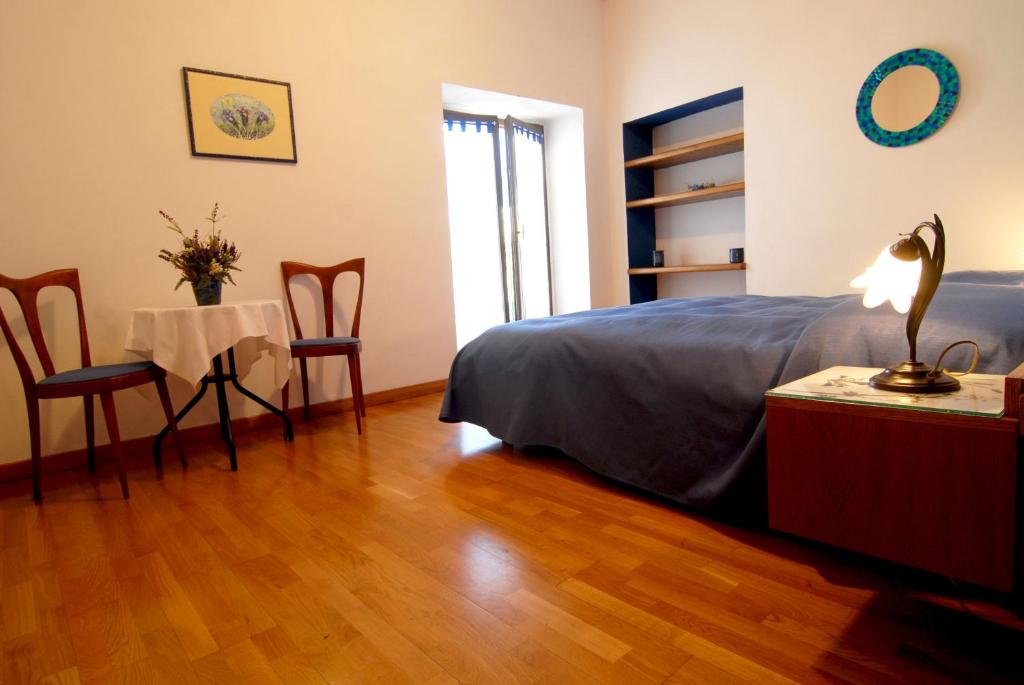 Postel nebo postele na pokoji v ubytování Cascina Roland