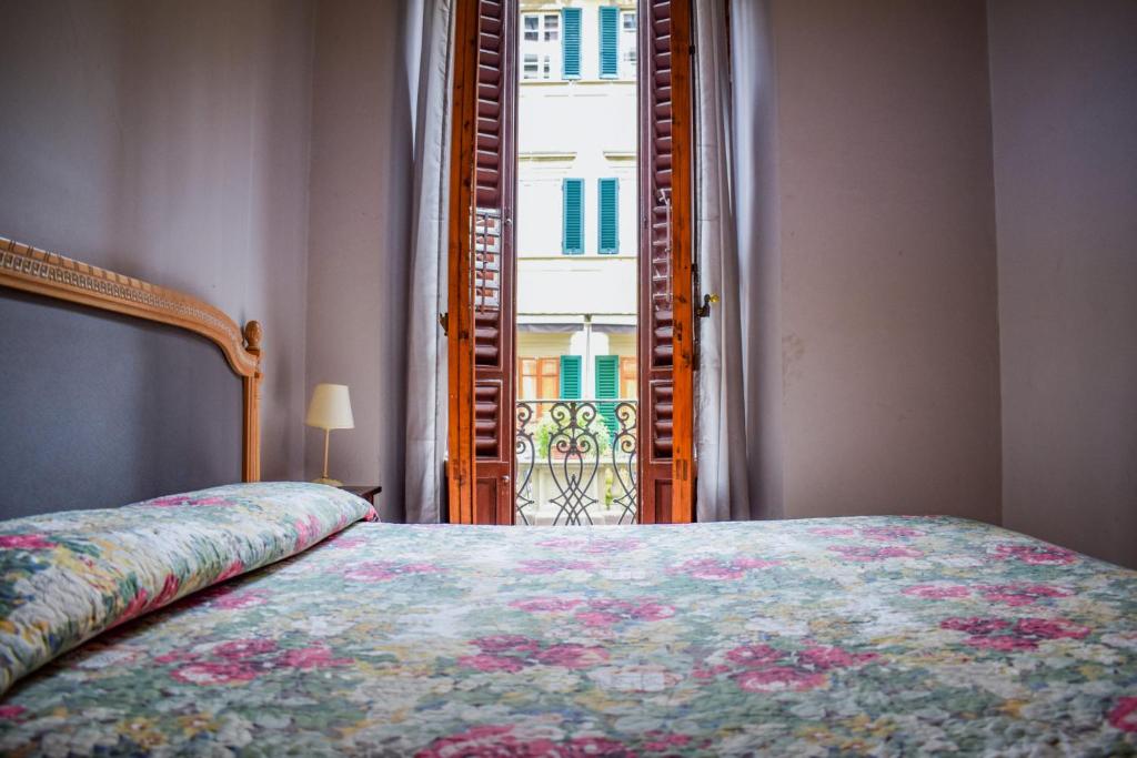A bed or beds in a room at Hotel Medici