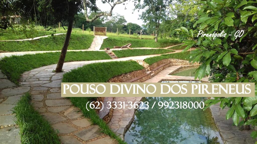 a walkway in a park with a pond at Pouso Divino dos Pireneus in Pirenópolis