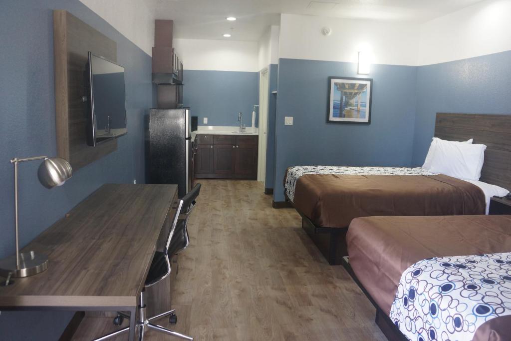 Postel nebo postele na pokoji v ubytování Texan Hotel