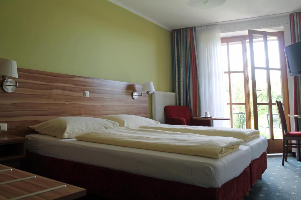 Posteľ alebo postele v izbe v ubytovaní Ferienhotel Herzog