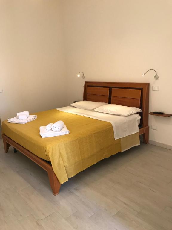 Postel nebo postele na pokoji v ubytování Le Camere Di Don Vito