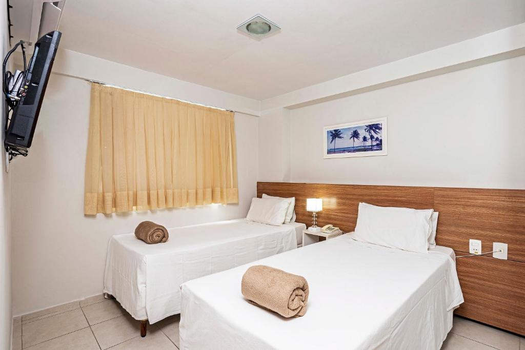 Cama ou camas em um quarto em Rede Andrade Solmar