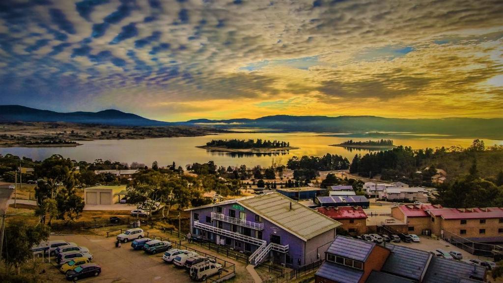 an aerial view of a town with a lake at Alpine Resort Motel in Jindabyne