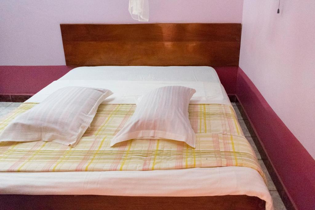 Postel nebo postele na pokoji v ubytování Starlight Hotel Mbale