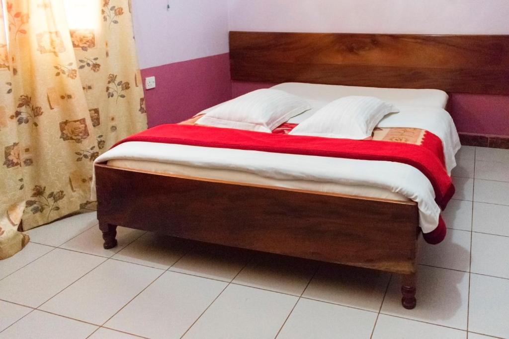 Postel nebo postele na pokoji v ubytování Starlight Hotel Mbale