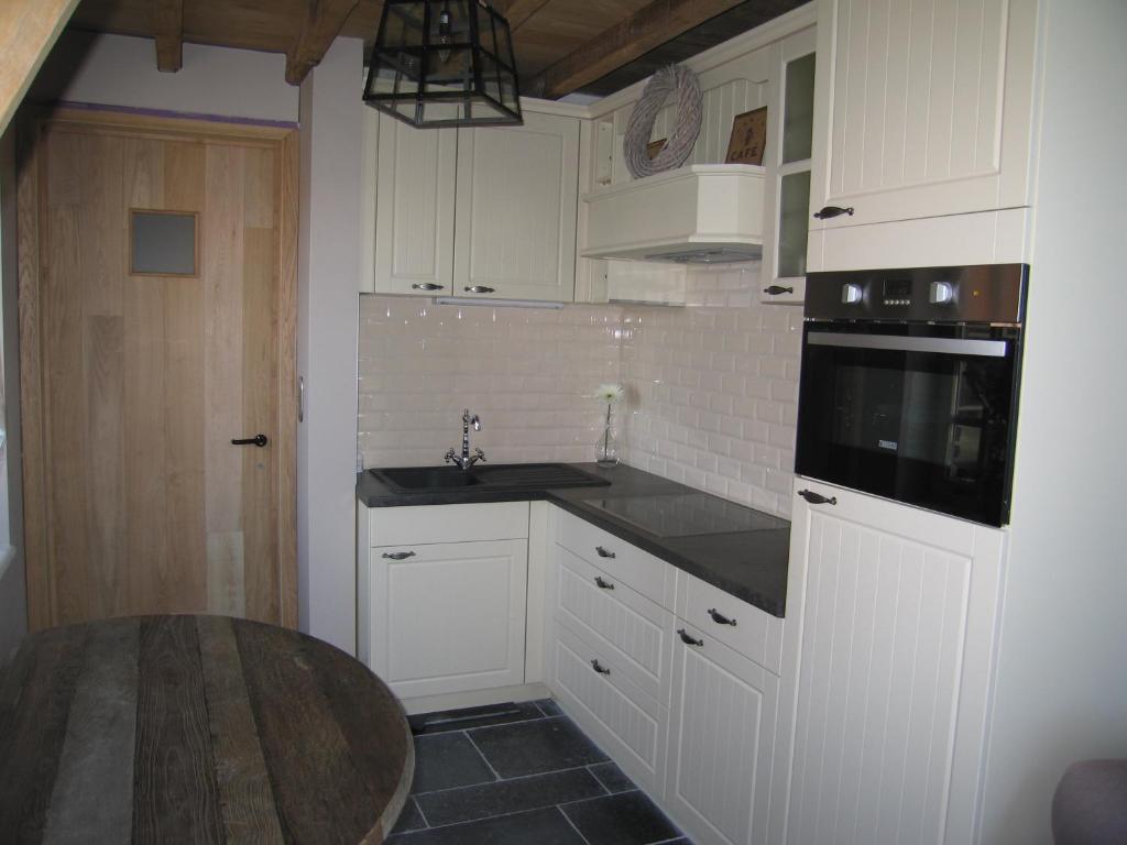 Kuchyň nebo kuchyňský kout v ubytování B&B Hoeve Ransberg