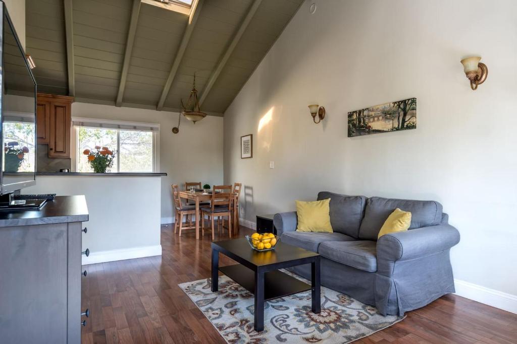 a living room with a couch and a table at Spacious, Soaring Ceilings, Near Downtown MV, GOOG in Mountain View