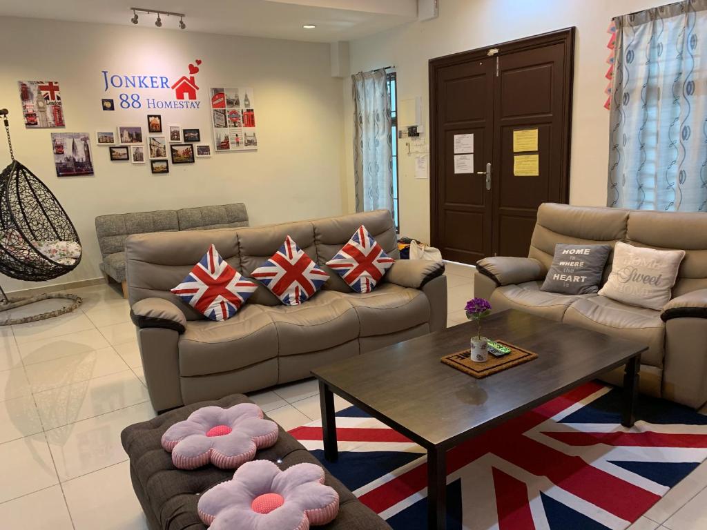 a living room with couches and a coffee table at Jonker 88 Homestay Melaka in Malacca