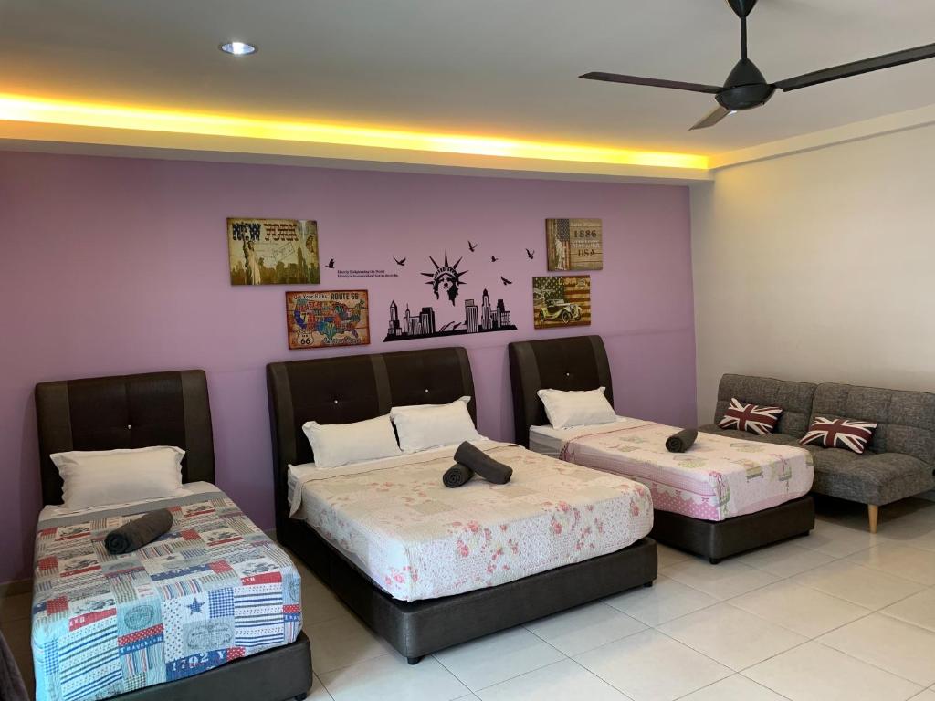 Postel nebo postele na pokoji v ubytování Jonker 88 Homestay Melaka