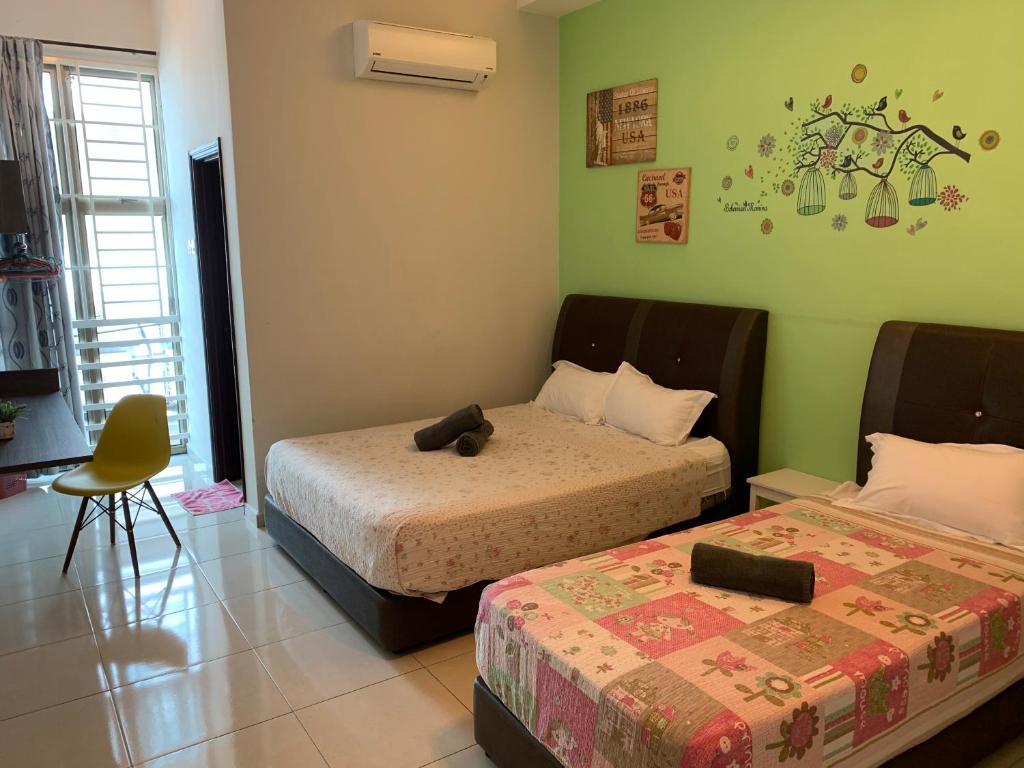 Postel nebo postele na pokoji v ubytování Jonker 88 Homestay Melaka