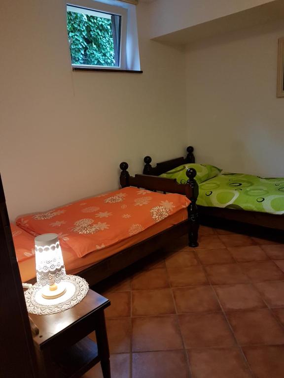 Postel nebo postele na pokoji v ubytování Garden Apartments Maria