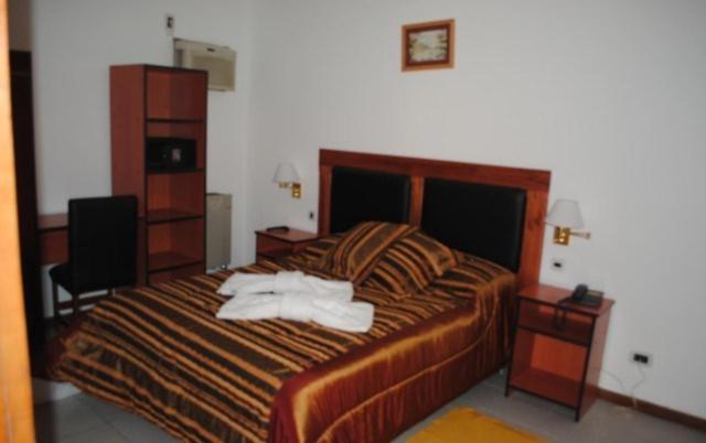 מיטה או מיטות בחדר ב-Hotel Tykua