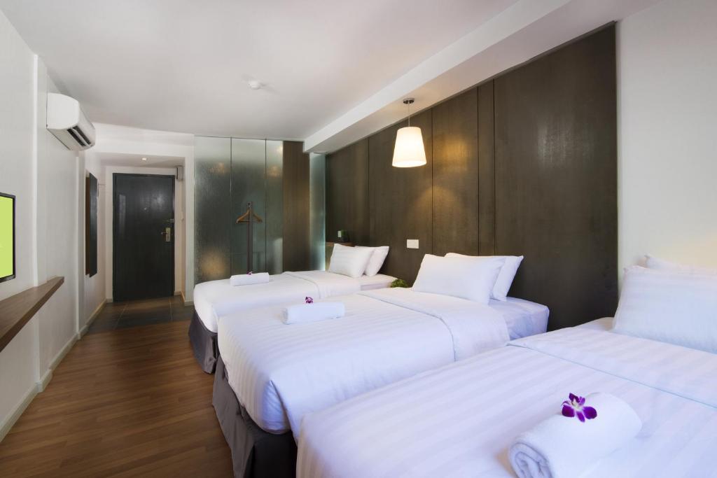 Postel nebo postele na pokoji v ubytování T+ Hotel Butterworth