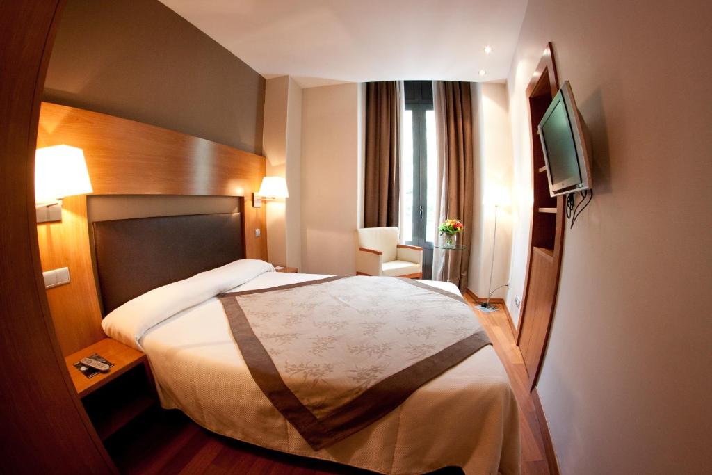 Postel nebo postele na pokoji v ubytování Alti Hôtel