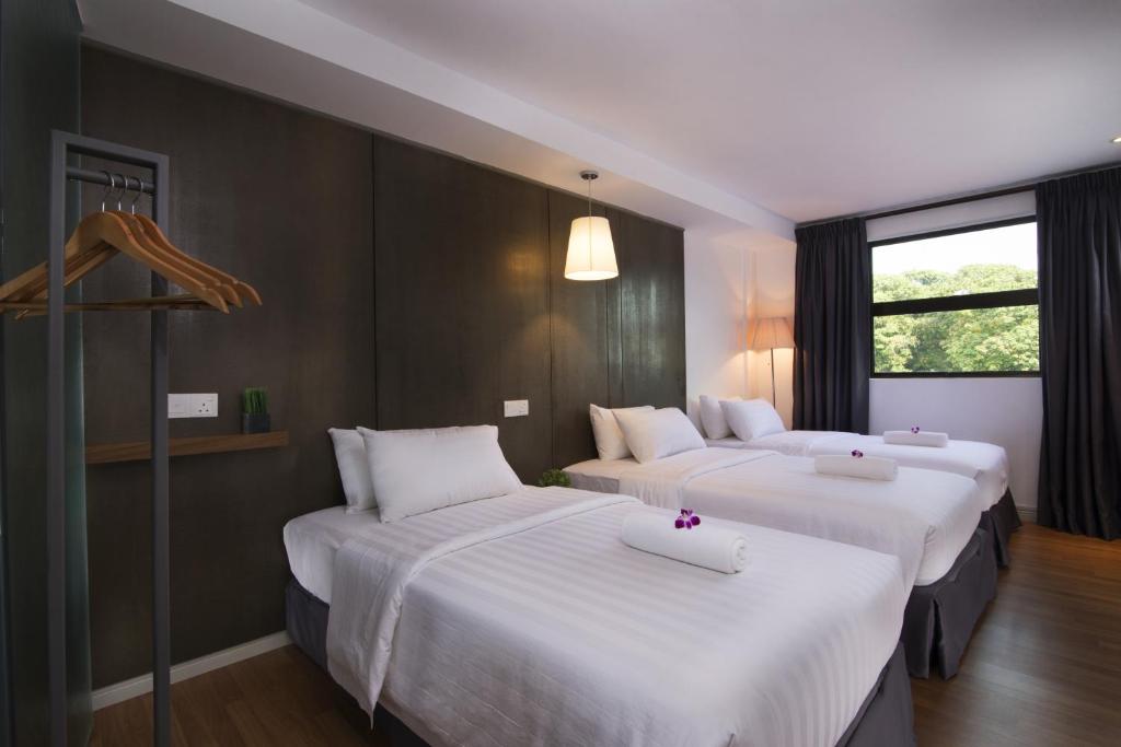 Postel nebo postele na pokoji v ubytování T+ Hotel Butterworth