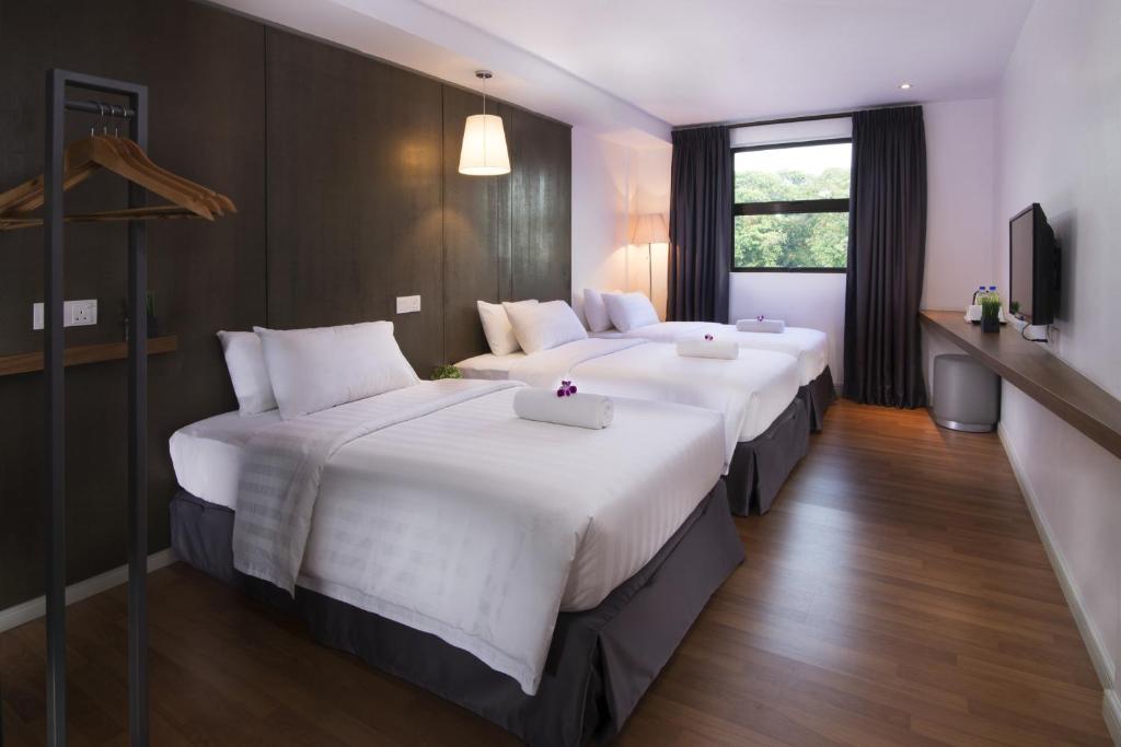 Postel nebo postele na pokoji v ubytování T+ Hotel Butterworth