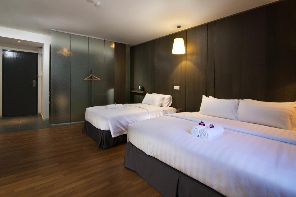Postel nebo postele na pokoji v ubytování T+ Hotel Butterworth