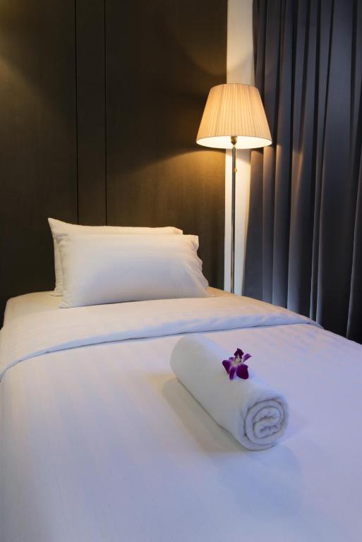 Postel nebo postele na pokoji v ubytování T+ Hotel Butterworth