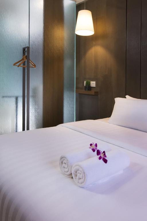 Postel nebo postele na pokoji v ubytování T+ Hotel Butterworth