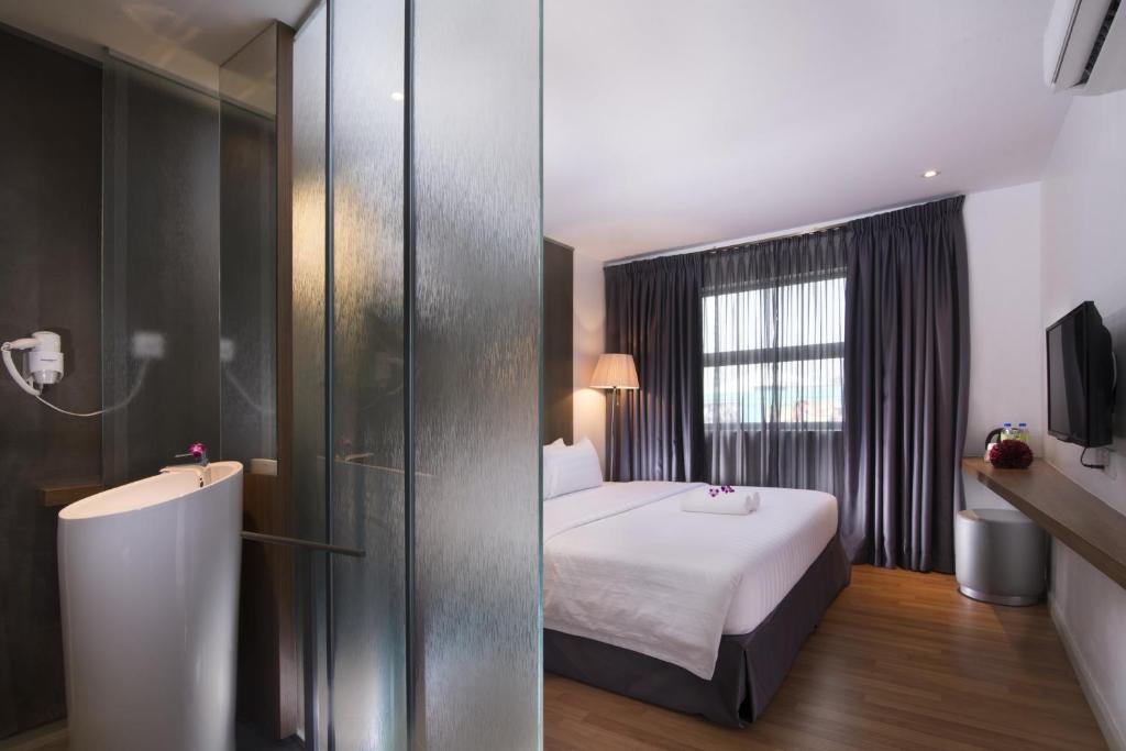 Postel nebo postele na pokoji v ubytování T+ Hotel Butterworth