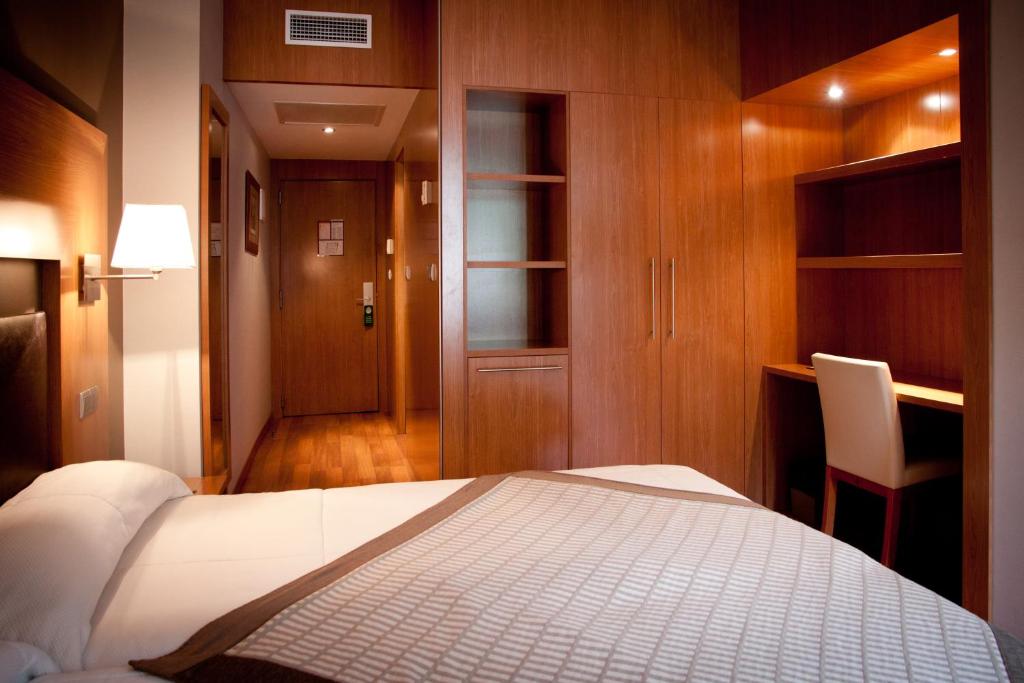 Postel nebo postele na pokoji v ubytování Alti Hôtel