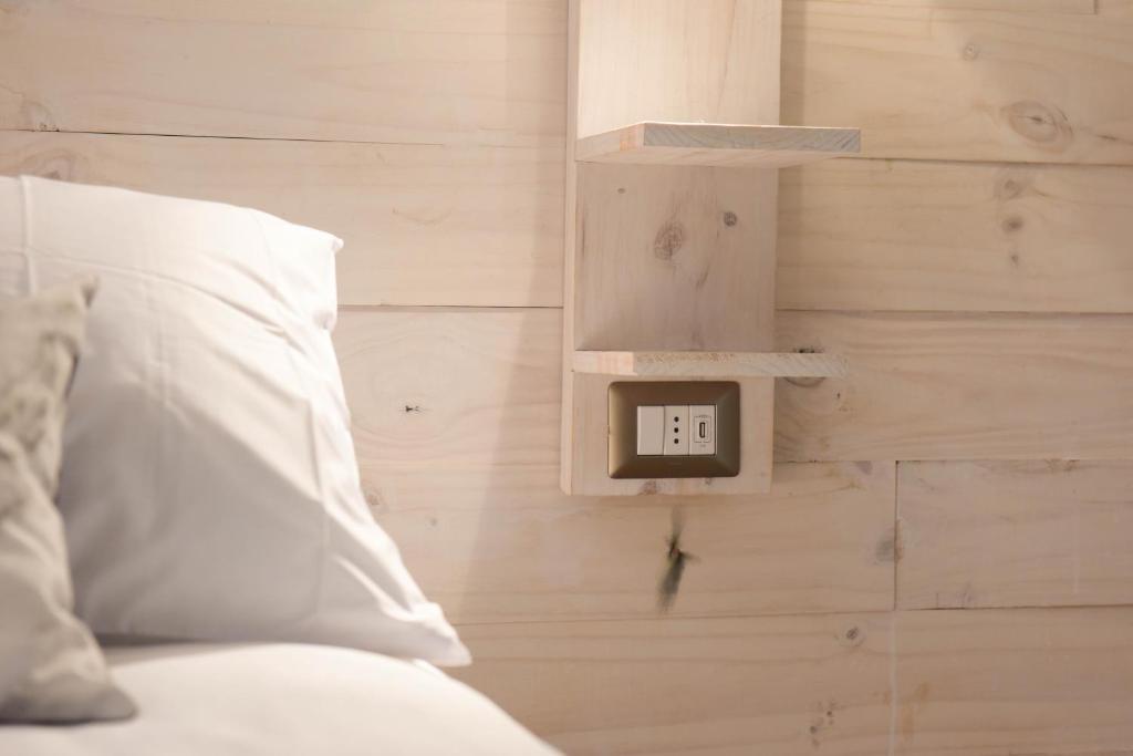 Postel nebo postele na pokoji v ubytování Hostal Boutique Puerta Roja