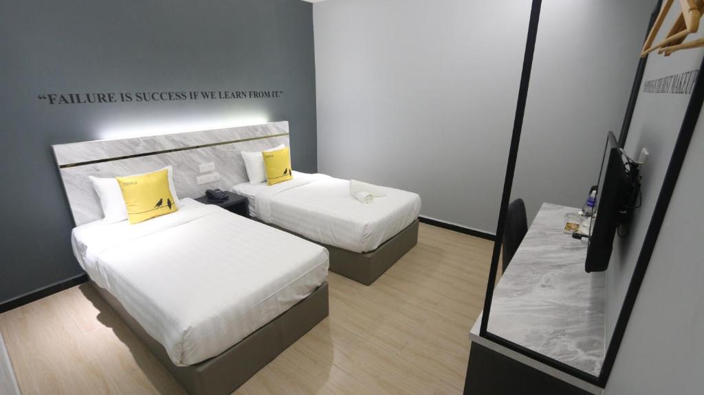 Postel nebo postele na pokoji v ubytování Hotel 99 Sepang KLIA & KLIA2