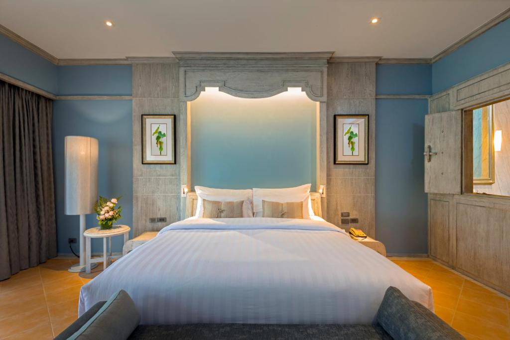 Кровать или кровати в номере Aonang Villa Resort I Beach Front