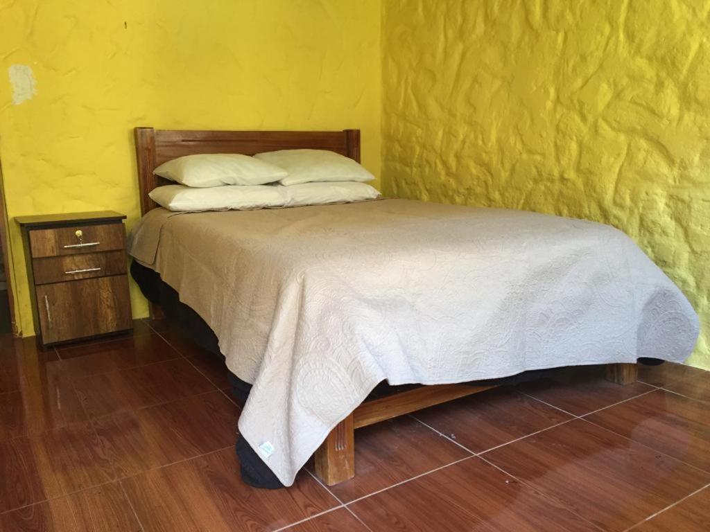 Postel nebo postele na pokoji v ubytování Paraiso Las Palmeras Lodge