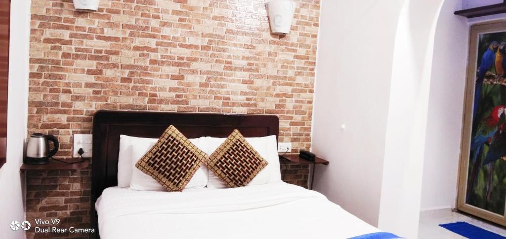 Postel nebo postele na pokoji v ubytování Serene Waters Homestay Goa