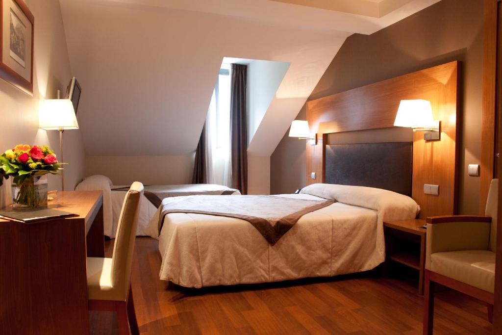 Postel nebo postele na pokoji v ubytování Alti Hôtel