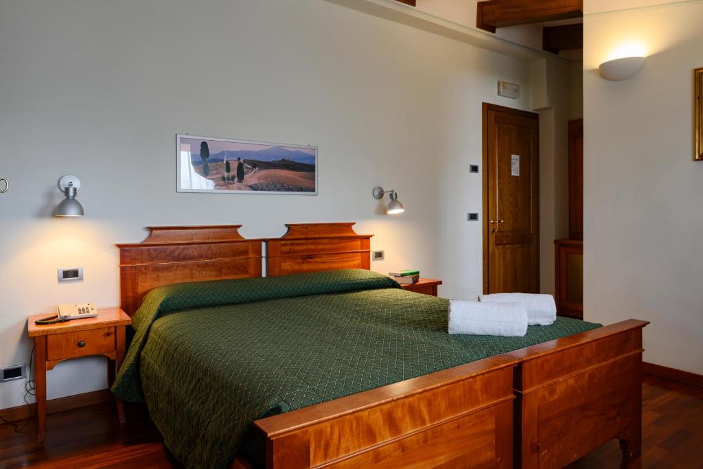 Postel nebo postele na pokoji v ubytování Hotel Rutiliano